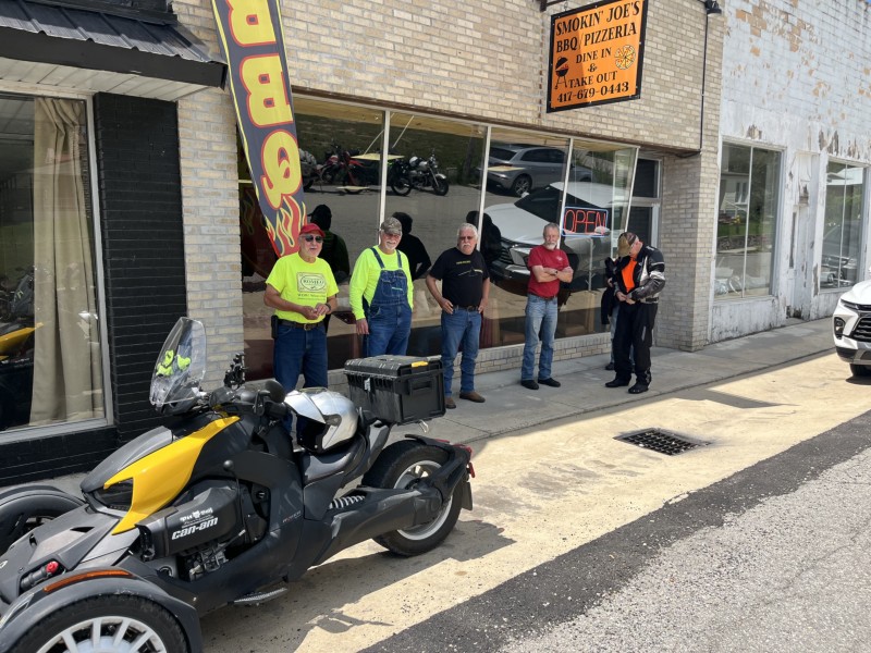 Couple of the men waiting for motorcycle valet service.