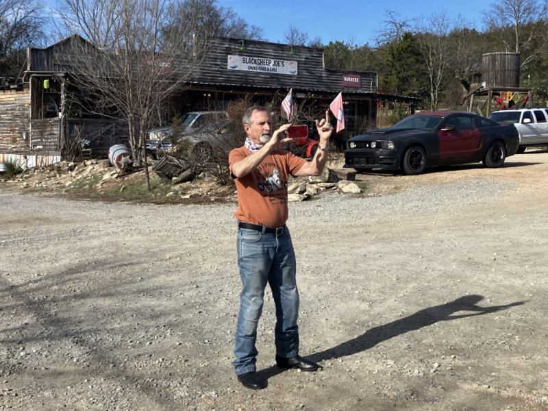 John is practicing his picture taking and hand gestures in preparation to be considered for a future Ride Director slot.