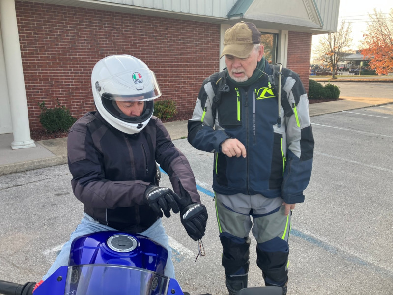 Mike and Glenn possibly discussing something about Mike’s riding apparel. Mike’s bike is sure beautiful. That blue is just striking.