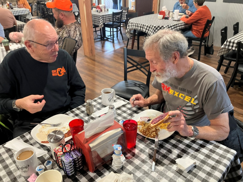 Mike finished his breakfast a bit early and was asking Jim for just a bite or two of his jellied toast.
