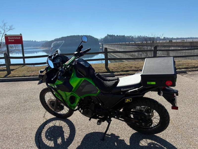 My (Ed) 2023 KLR 650S. S is for shorter .. even though it’s still a very tall bike. KLRs are really nice and rugged bikes. Norfork dam is in the background. Water very low.