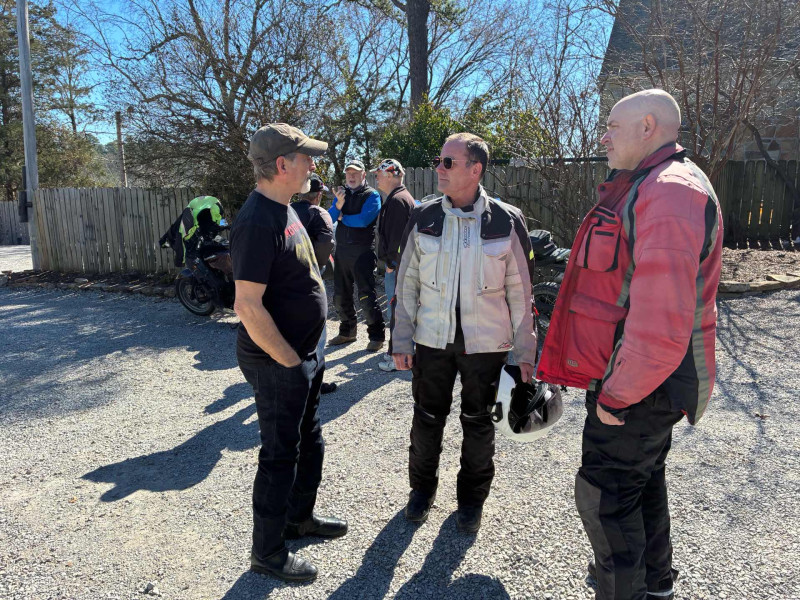 John and the two Merryman brothers talking about motorcycles I presume.