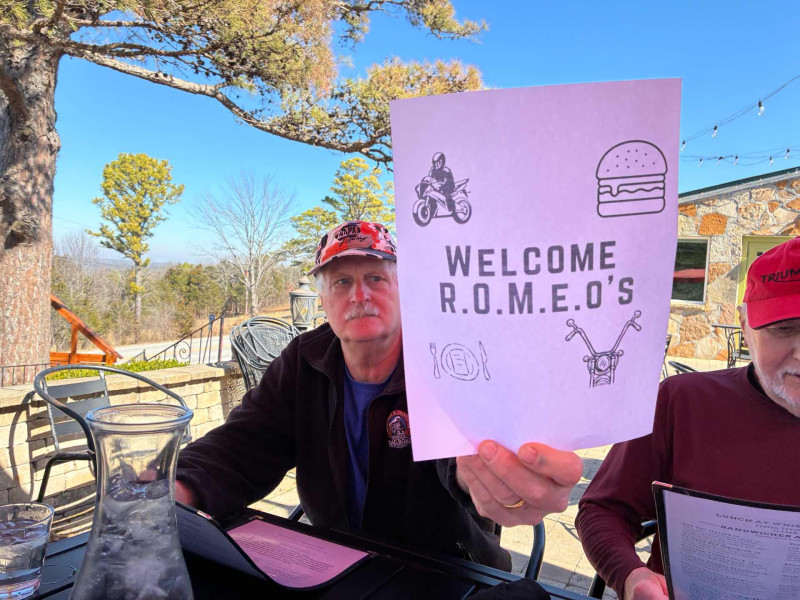 Fred holding up our custom ROMEOS welcome sign. Thank you Whispering Woods for that cool sign.