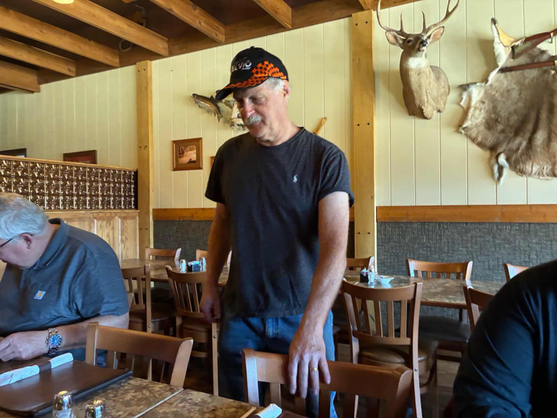 Fred Harmon noticed I was sitting across from him so he decided to just stand … actually he sat next to Dr. Neil Smith … and thank God he did. He helped Neil trouble shoot his ongoing V11 Sport vapor lock impediment. Someone help Neil please.