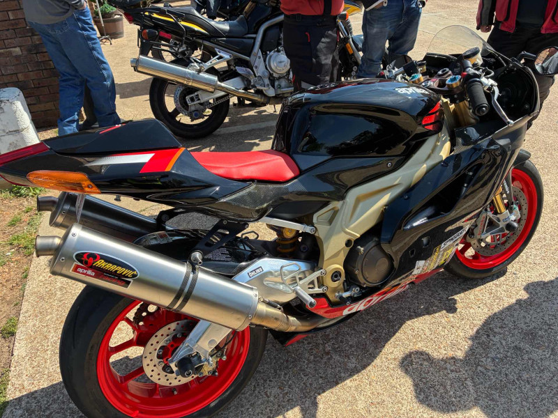 Bill’s Aprilia missle. That bike has the best exhaust sound. Beautiful colors too. No I don’t want to buy it.  No more room in my garage.