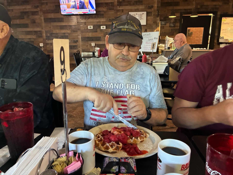 Don chowing down on some delicious strawberry waffles. I almost asked him for one bite .. but I knew better.